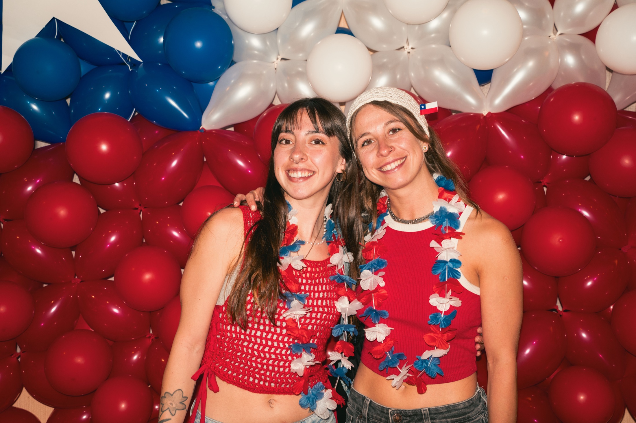Guests celebrating in a balloon-filled event space