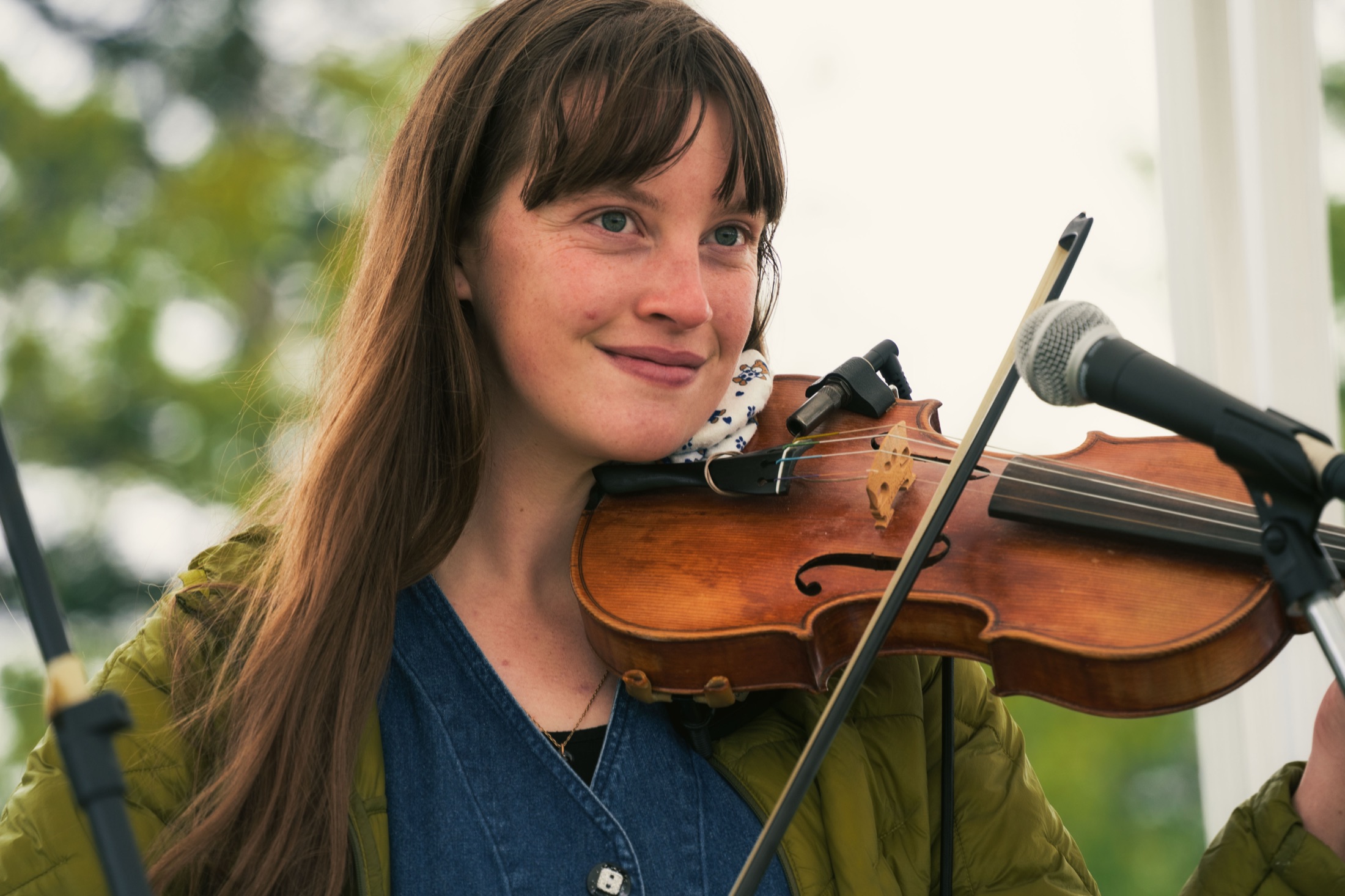 Musician performing at an outdoor community event